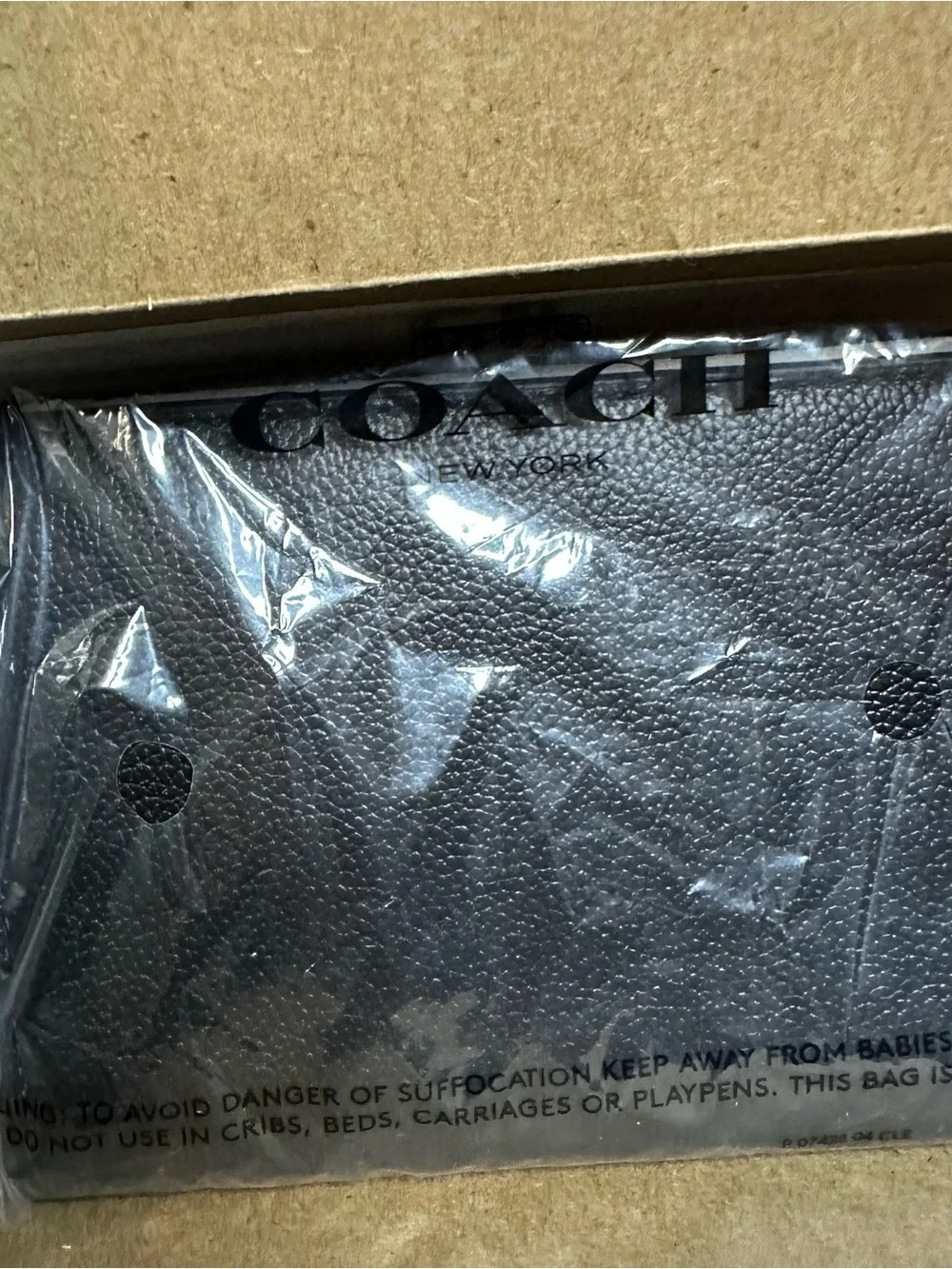 Coach Passport/card holder Black Pebbled Leather.